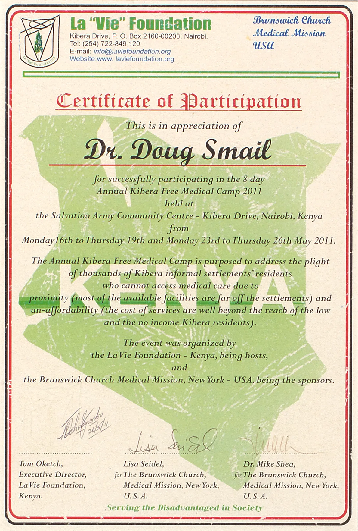 Dental clinician providing professional care to child patient in Kenya clinic partnership